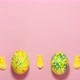Yellow velvet bunnies and easter eggs on pink background at the top and bottom with space for text - VideoHive Item for Sale