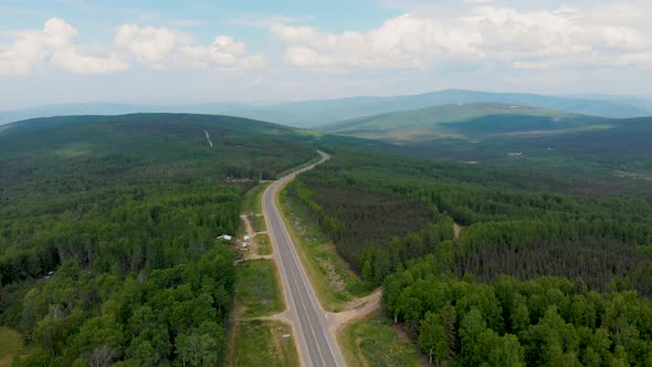 4K Drone Video of Elliott Highway through White Mountains near Fox, Alaska on Summer Day alt