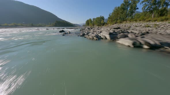 FPV Sport Drone Dynamic Shot Active Travel Woman Running Sharp Cliff Stone River alt