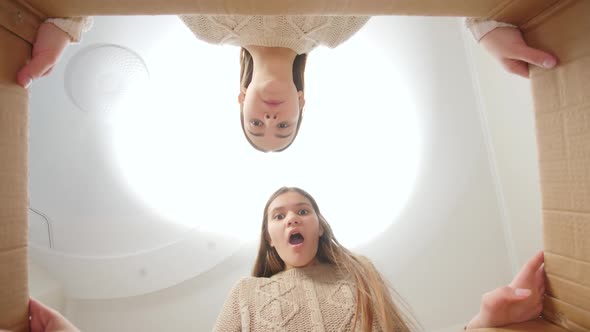 Two Teenage Sisters Got Amazed and Surprized After Opening Big Cardboard Box with Parcel alt