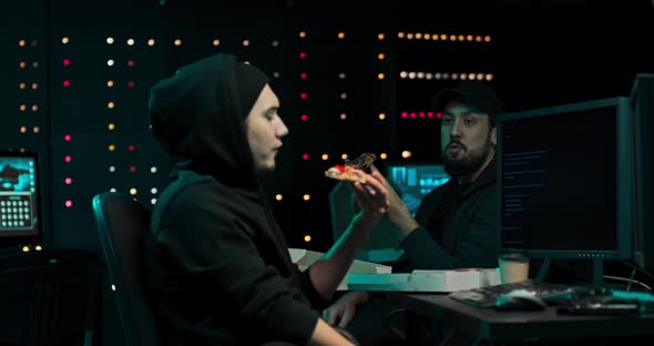 Hackers Eat Pizza and Chat in a Secret Hideout While Writing Malware alt