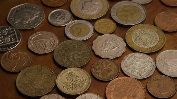 Rotating stock footage shot of international monetary coins - MONEY 0386 alt