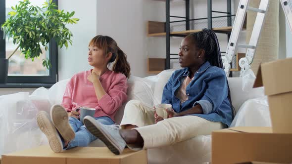 Women Moving to New Home and Drinking Coffee alt