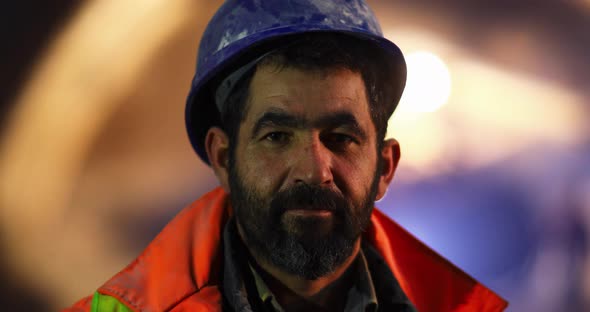 Portrait of Worker Looking at Camera alt