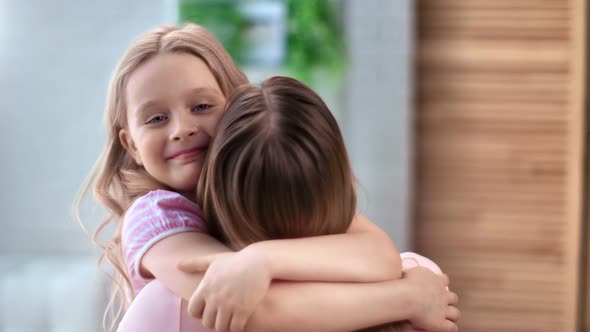 Cute Girl Hugging Mother Smiling Feeling Love and Positive Emotion alt