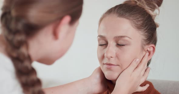 Teen Girl is Learning to Apply Make Up to Her Mother She Applied the Eyshadows on the Eyelids of alt