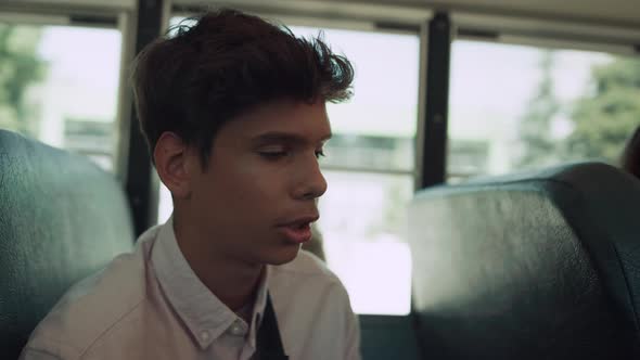 Indian Teen Boy Sitting Bus Talking Passenger Close Up alt