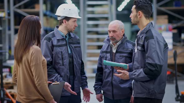 Troubled Warehouse Employees Talking Discussing Failure in Cargo Shipping alt