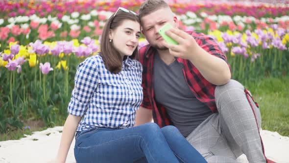 Young Couple Making Selfie alt