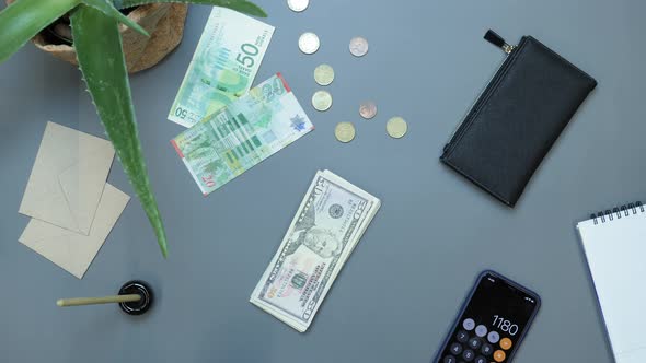 Hands in blue protective medical gloves taking US money banknotes off from office table alt