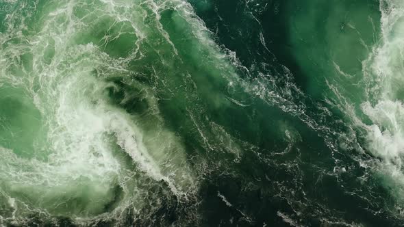Waves of Water of the River and the Sea Meet Each Other During High Tide and Low Tide alt