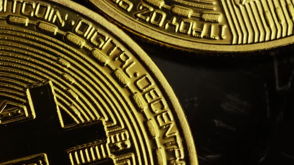 Rotating shot of Bitcoins (digital cryptocurrency) - BITCOIN 0039 alt