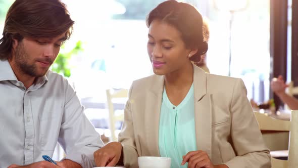Businesspeople interacting while in a meeting alt