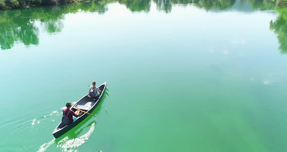 Man Cycling on the Machine Trainer He is Exercising in the Home alt