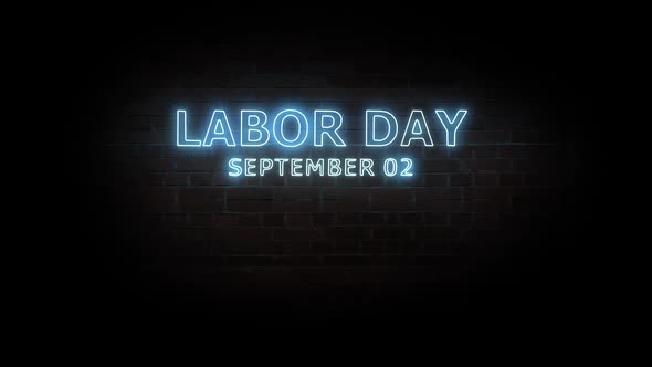 Labor day. Text neon light on brick wall background.