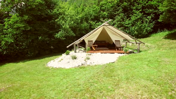 Tracking shot of a glamping tent in an eco camping in Slovenia. alt