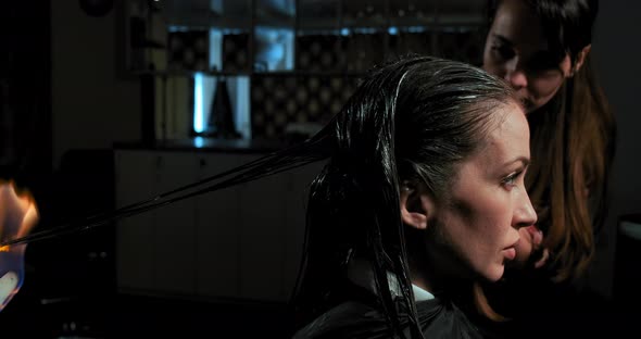 Hairdressers Apply Special Balms and Fire Cut Technique alt