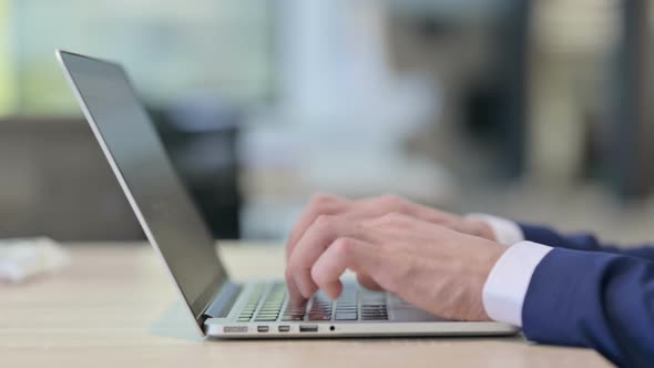Close Up of Hands Typing on Laptop alt
