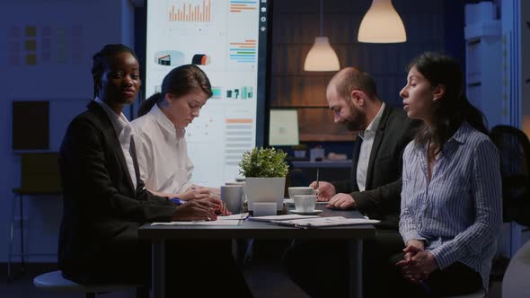 Pov of Diverse Businesspeople Analyzing Company Strategy Discussing Corporate Statistics alt