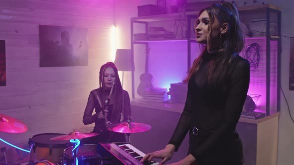 Rock Girls Giving Concert At Night alt