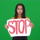 Frustrated Depressed African American Teenage Girl Showing Stop Message Banner Looking at Camera - VideoHive Item for Sale