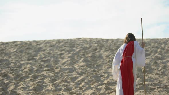 Moses With Staff Walking in Desert, Reaching Out Hand to Camera, Rescue Souls alt