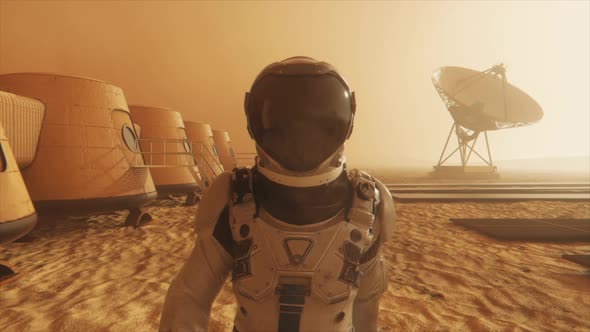 Astronaut on the Planet Mars Making a Detour Around His Base alt