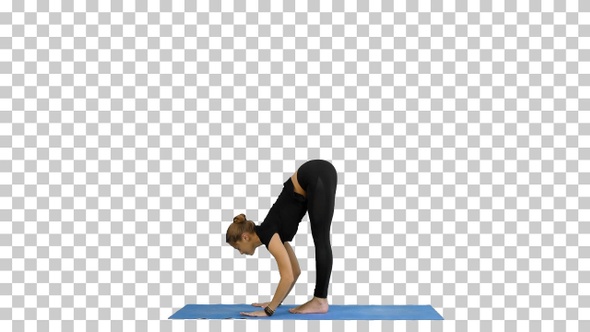 Young woman doing yogic sun salutation pose on mat, Alpha Channel