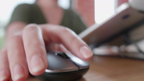 Female hands of business freelance Asian woman click mouse button alt