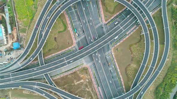 Top View to the Cars Driving on Multilevel Highway on the Sunset alt