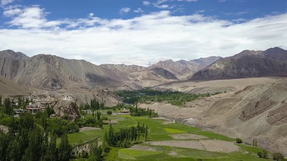 Stunning landscape in Ladakh India. Aerial view of lush farms and himalayan peaks alt