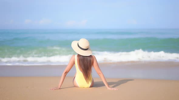 Asian woman enjoy around beautiful beach sea ocean alt