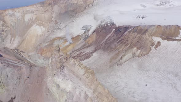 Aerial Drone Footage of Mutnovsky Volcano Crater with Fumaroles and Glacier