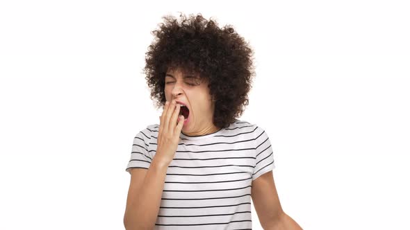 Close Up Portrait of Mixedrace Lady Being Sleepy Yawning and Stretching Covering Open Mouth with alt