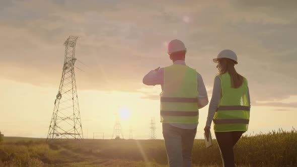 Back Two the Engineer and the Controller with a Tablet PC and the Drawings are About Lines and alt