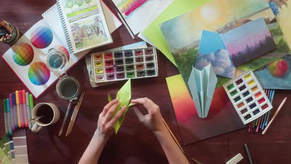 Artist Making Origami Top View alt