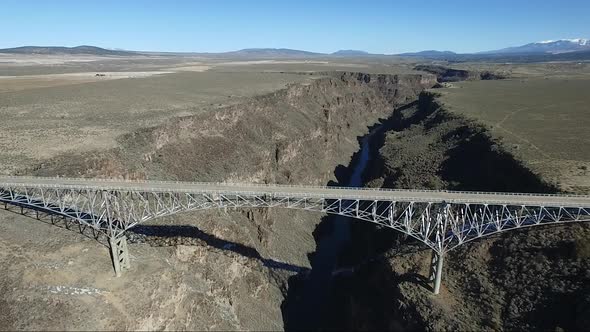Drone video of the Rio Grande Gorge Suspension Bridge Colorado New Mexico Taos Snow alt