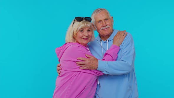 Cheerful Lovely Senior Couple Man Woman Grandparents Smiling Hugging Enjoying Lifestyle Together alt