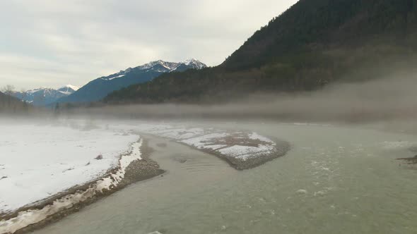 Aerial View of Chilliwack River with Snow During Winter Season alt