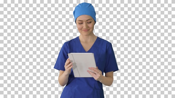 Smiling female nurse using tablet computer, Alpha Channel alt