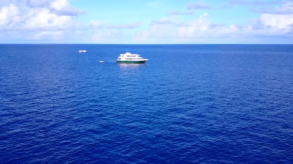 Empty texture of exotic seashore beach break by sea with sand background near palms alt