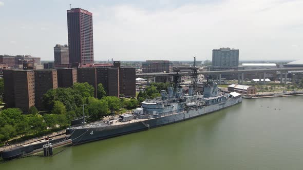 USS The Sullvan's destroyer in Buffalo, New York drone video pulling away. alt