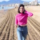 Dressed Young Woman Goes Along the Coastline and Smiling Slow Motion - VideoHive Item for Sale