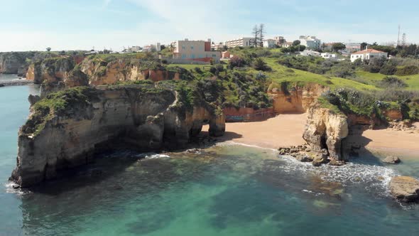 Little Estudante Beach surrounded by rock formations near Lagos, Algarve, Portugal alt
