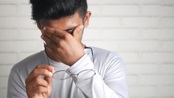 Close Up of Upset Man Suffering From Strong Eye Pain alt