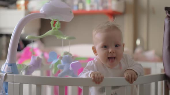 Cute Baby Girl Playing In A Round Crib By Grey Coast Media Videohive