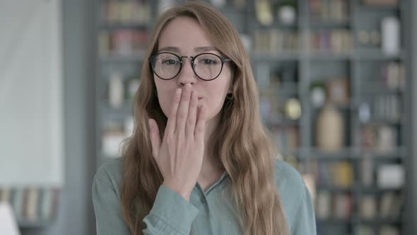 Portrait of Cheerful Young Woman Giving Flying Kiss at Camera alt