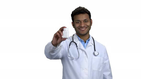 Doctor Showing Pills and Thumb Up to Camera alt