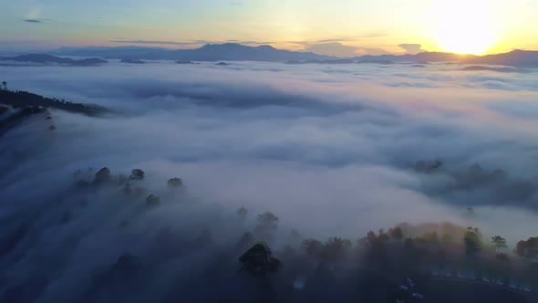 Drone is flying over sea and mist or fog Landscape High angle view Dynamic aerial shot alt