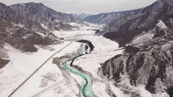 Aerial View of Mountain Valley with Stunning Turquoise Curving River Chuya